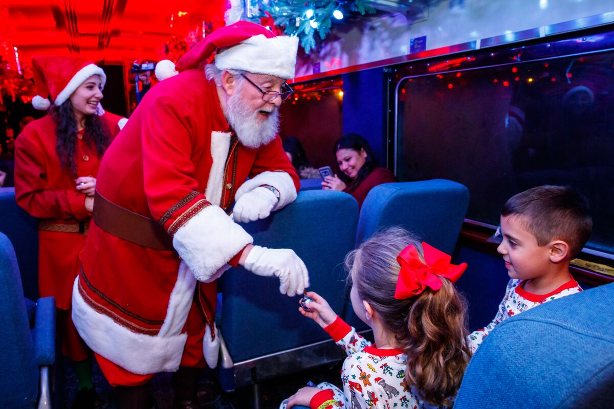 Santa appears with gifts for kids during the hour-long Polar Express ride.