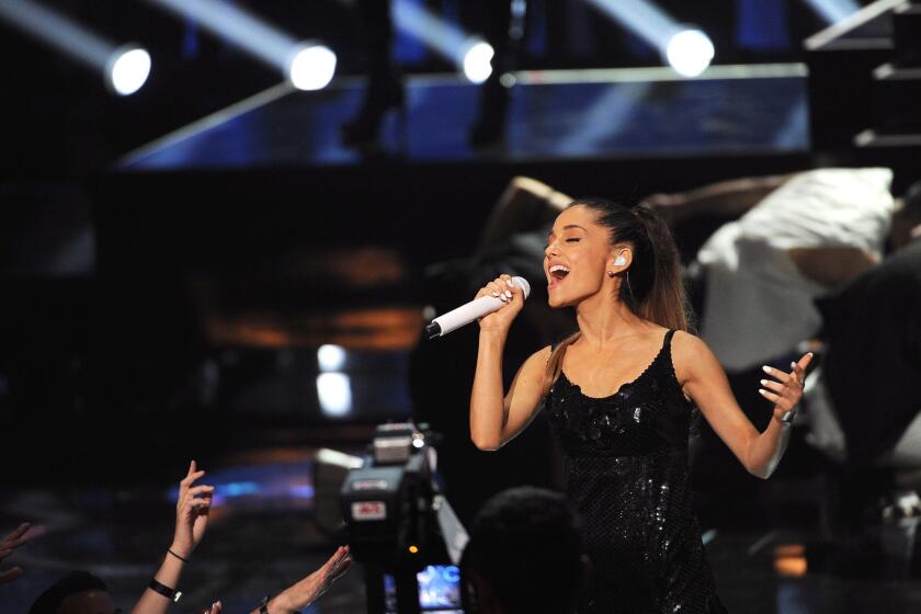 Ariana Grande performs at the iHeartRadio Music Awards at the Shrine Auditorium.