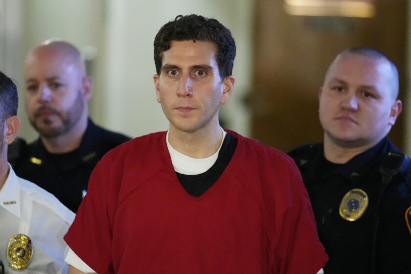 Bryan Kohberger, who is accused of killing four University of Idaho students, is escorted to an extradition hearing at the Monroe County Courthouse in Stroudsburg, Pa., Tuesday, Jan. 3, 2023. (AP Photo/Matt Rourke, Pool)