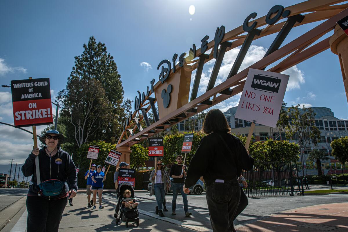 Protesters march in front of Disney's Burbank facilities.