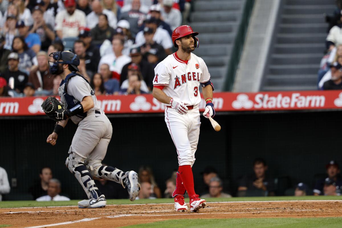Chris Taylor walks back to the dugout after striking out Monday