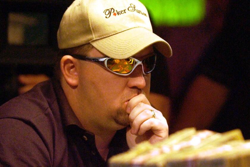 @@*@@* ADVANCE FOR SUNDAY, AUG. 24 @@*@@*FILE@@*@@*Chris Moneymaker of Spring Hill, Tenn., plays the final hand of the World Series of Poker, May 24, 2003 at the Binion's Horseshoe Casino in Las Vegas. Moneymaker, who won the $2.5 million tournament after qualifying in a $40 Internet tournament, has legislators taking a second look at possible regulation of internet gambling. (AP Photo/Joe Cavaretta)