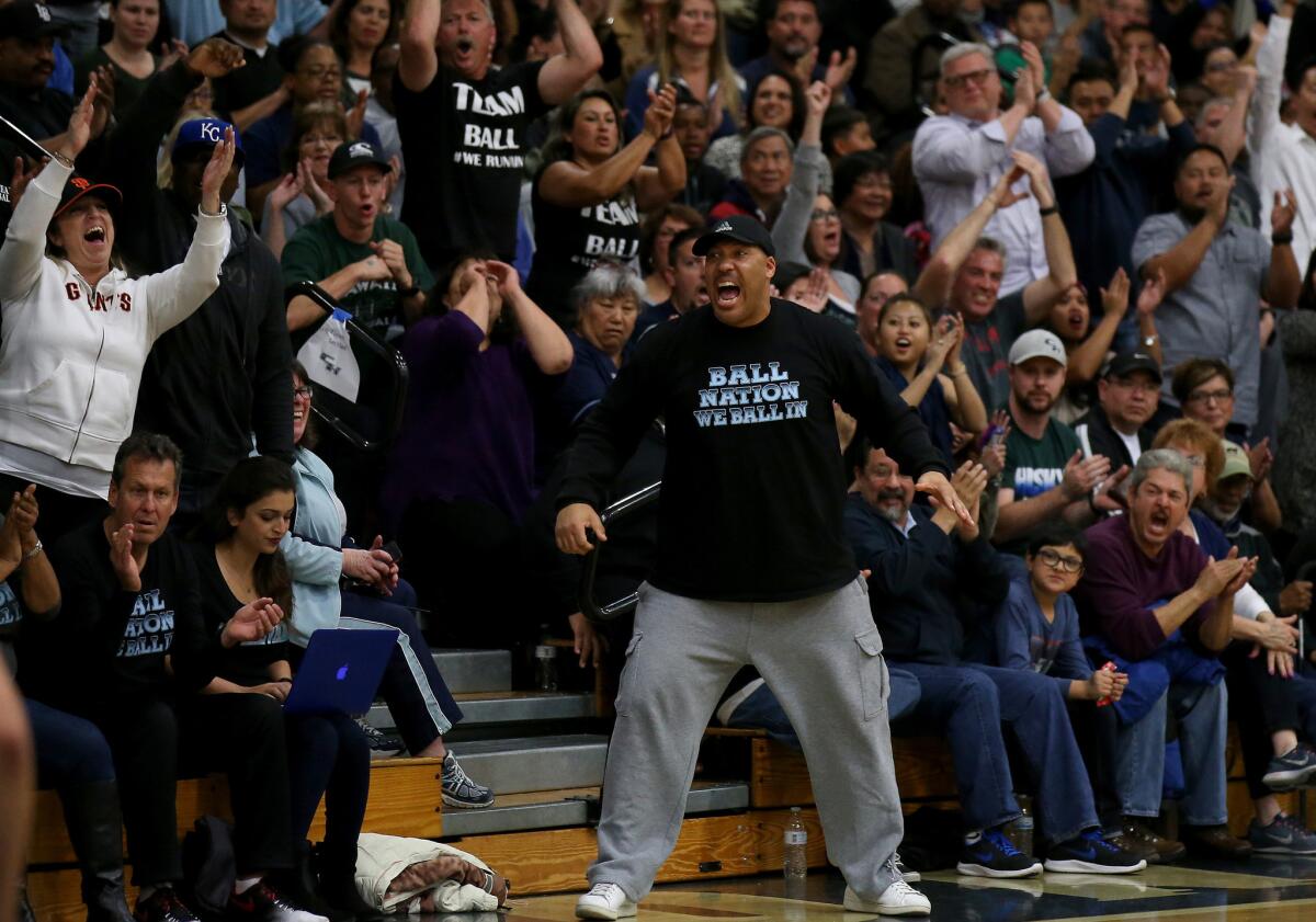 LaVar Ball cheers for his sons during Chino Hills' victory over Immanuel during a regional playoff game Friday.