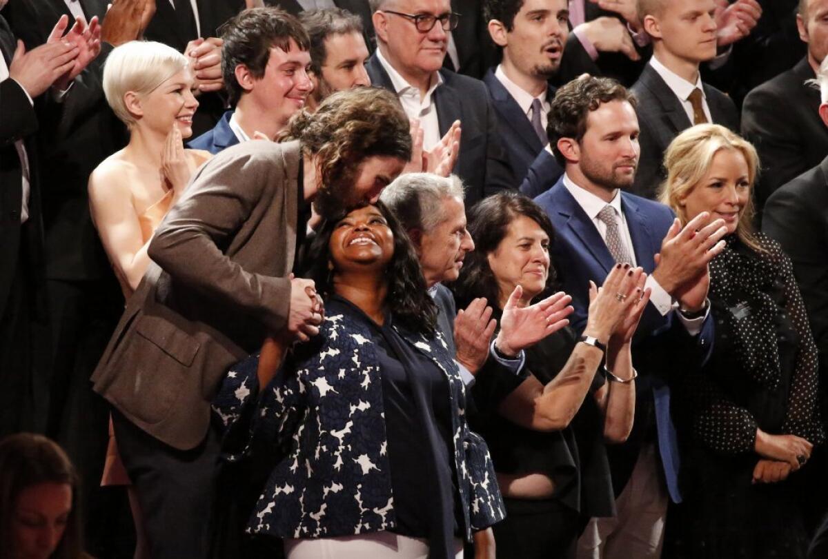 Casey Affleck kisses Octavia Spencer on the platform Monday as they prepare for the class picture of all the nominees during the Academy Awards annual nominees luncheon for the 89th Oscars at the Beverly Hilton Hotel in Beverly Hills.