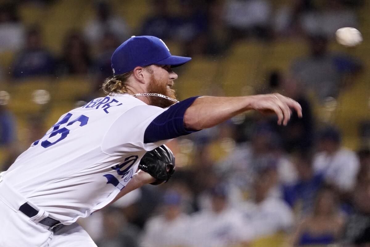 Los Angeles Dodgers relief pitcher Craig Kimbrel throws to the plate during the ninth inning of a baseball game against the San Francisco Giants Tuesday, Sept. 6, 2022, in Los Angeles. (AP Photo/Mark J. Terrill)