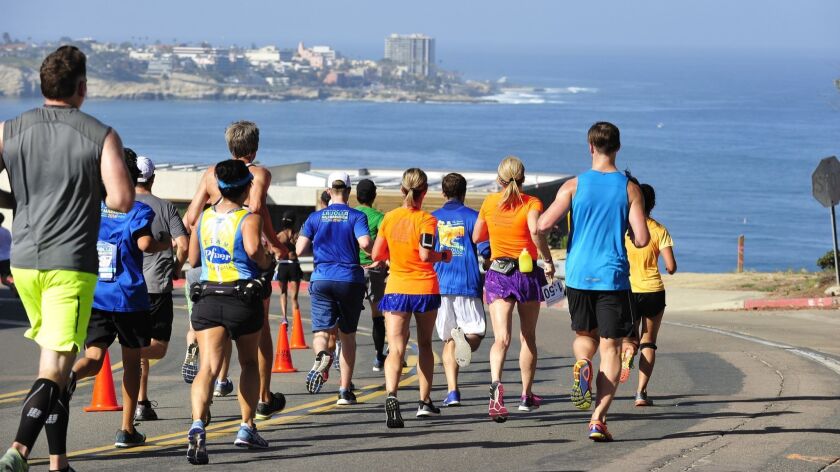 La Jolla Half Marathon runners head south on Torrey Pines Road with views of La Jolla Cove during this part of the course, while getting closer to the finish line at Ellen Browning Scripps Parks.