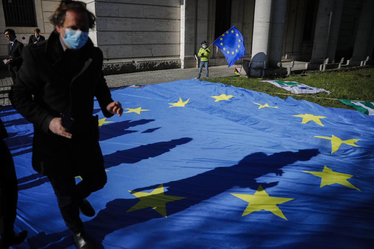 A European flag decorates an event in Berlin to collect signatures for more support for Italy during the COVID-19 pandemic.