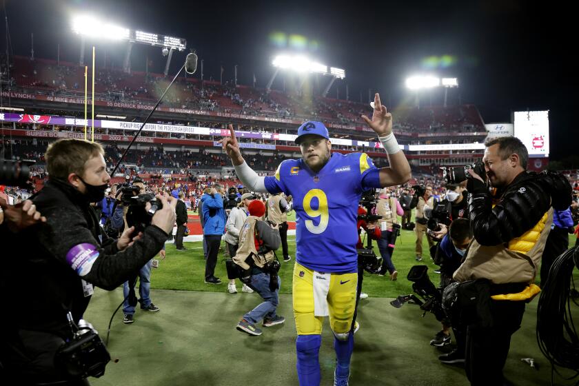 TAMPA BAY, FL- JANUARY 23, 2022: Los Angeles Rams quarterback Matthew Stafford (9) gives the victory sign.