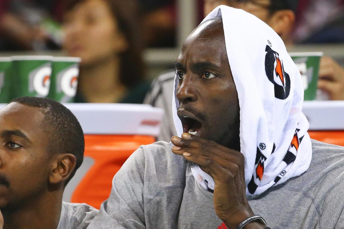 Kevin Garnett reacts from the bench during the game between the Brooklyn and Sacramento in China.