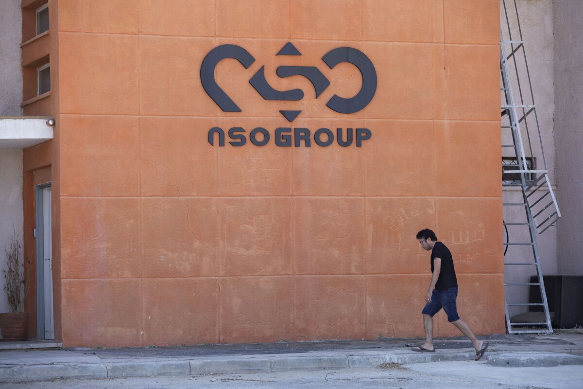 FILE - A logo adorns a wall on a branch of the Israeli NSO Group company, near the southern Israeli town of Sapir, Aug. 24, 2021. The cellphones of six Palestinian human rights activists were infected with spyware from the notorious Israeli hacker-for-hire company NSO Group as early as July 2020, a security researcher discovered just days before Israel’s defense minister branded some of their employers terrorist organizations. It was the first time the military-grade Pegasus spyware was known to have been used against Palestinian civil society activists. (AP Photo/Sebastian Scheiner, File)