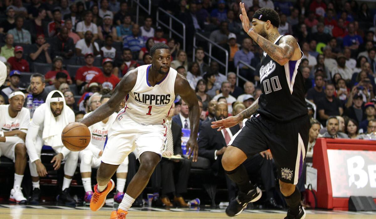 Los Angeles Clippers' Lance Stephenson, left, drives past Sacramento Kings' Willie Cauley-Stein during the first half on Saturday.