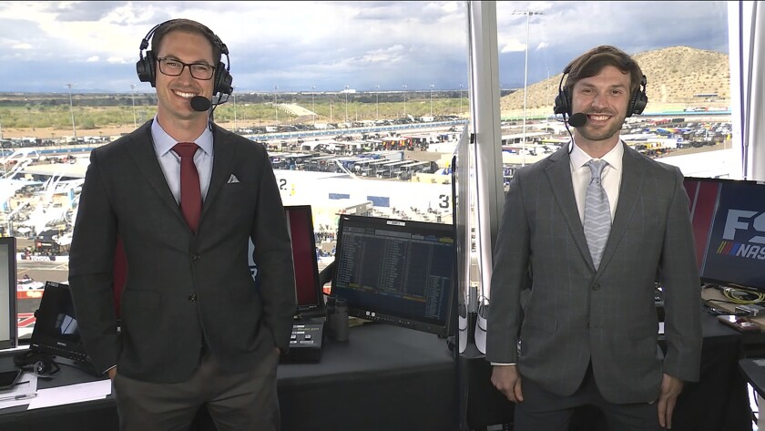 In this still image from video, NASCAR drivers Joey Logano, left, and Daniel Suarez pose at Phoenix Raceway in Avondale, Ariz., where they we're the Fox Sports co-analysts for the Xfinity Series auto race on Saturday, March 13, 2021. Suarez is the first Mexican analyst used in the broadcast of a NASCAR national series race and called a lap in his native Spanish. (Fox Sports via AP)