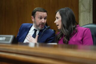 A man and a woman talk.