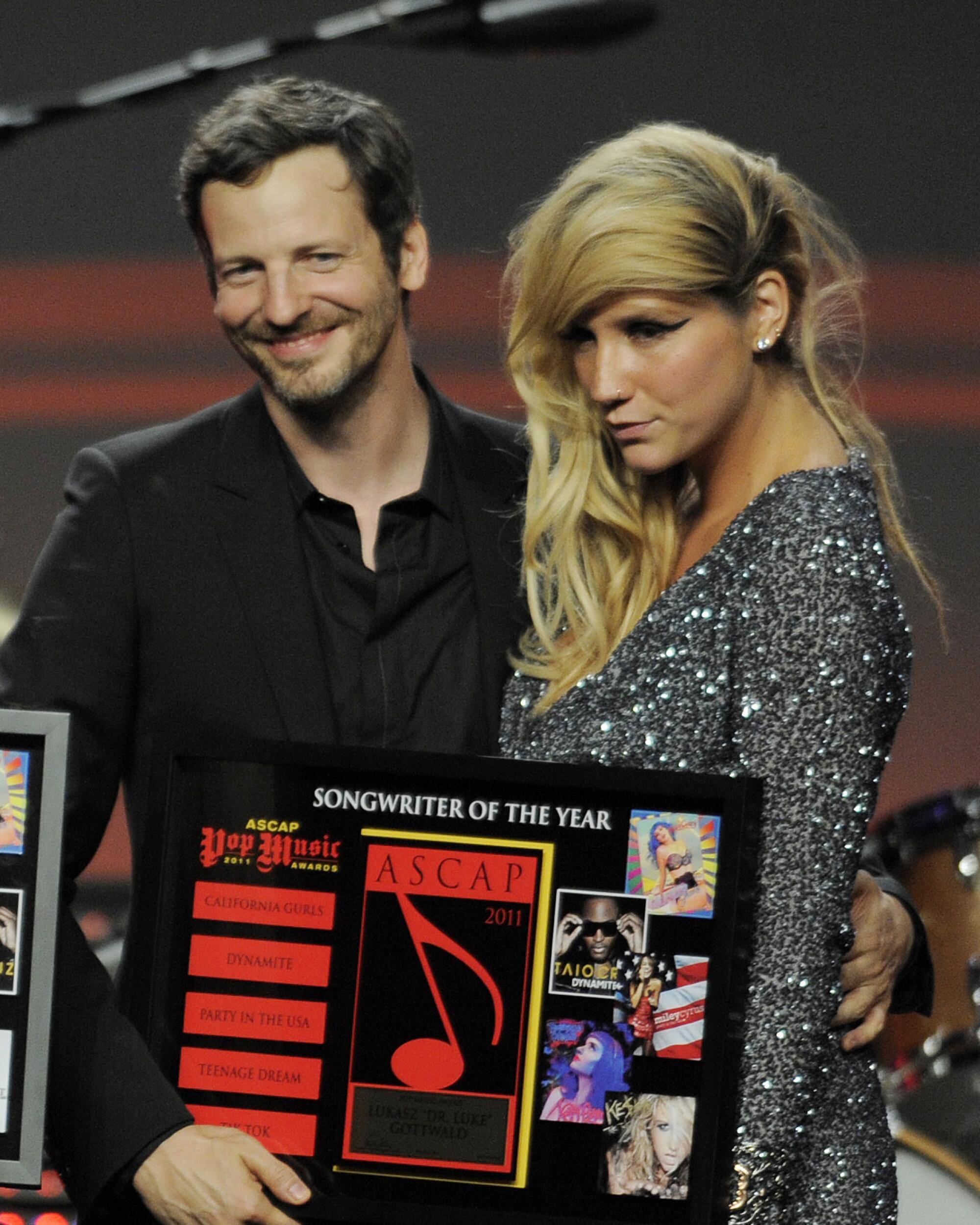 Lukasz "Dr. Luke" Gottwald poses with singer Kesha at the 28th Annual ASCAP Pop Music Awards in Los Angeles in 2011.