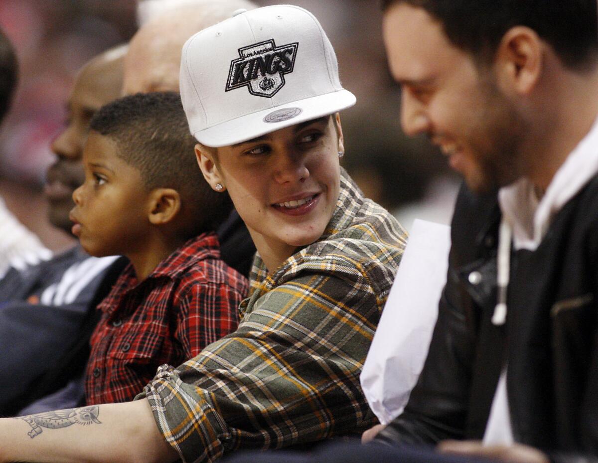 Pop star Justin Bieber takes in a Clippers-Celtics game in December 2012.