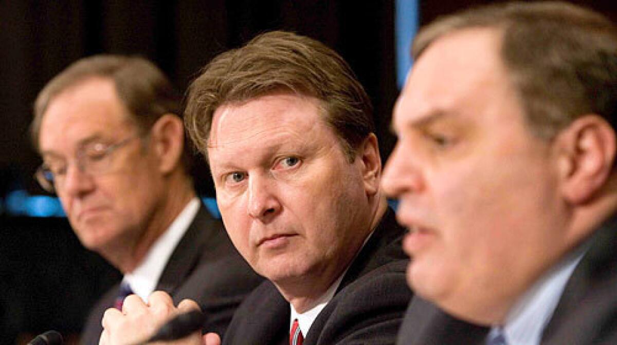 "The only way were going to be successful is to truly mount a comprehensive attack upon the cartels," said Arizona Atty. Gen. Terry Goddard, left, with Justice Department officials William Hoover and Anthony Placido.