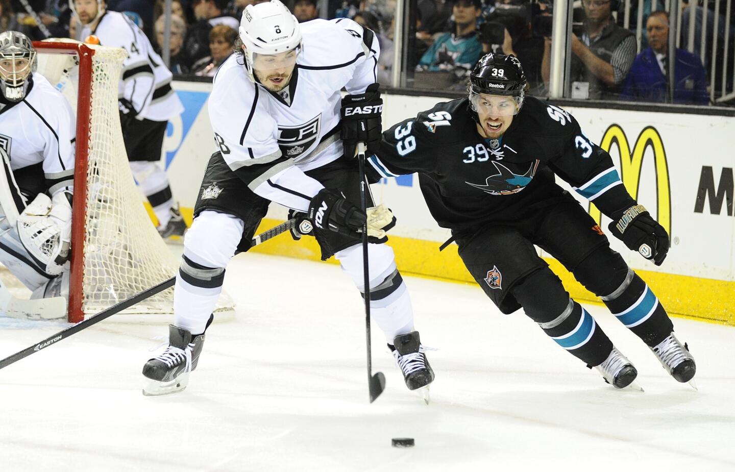 Kings defenseman Drew Doughty, left, and San Jose Sharks forward Logan Couture during the Kings' 3-0 win in Game 5 of the Western Conference quarterfinals.