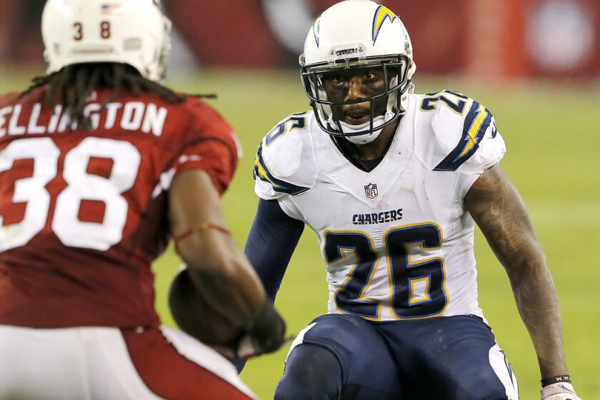 Chargers cornerback Brandon Flowers (26) prepares to tackle Cardinals running back Andre Ellington during a game earlier this season.