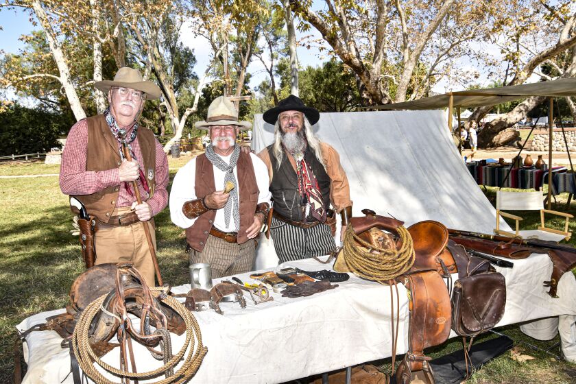 From left, Tim Jordan Lee DiBernardo and Randy Borks with equipment typical of late 1860s-1890s cattle drives.