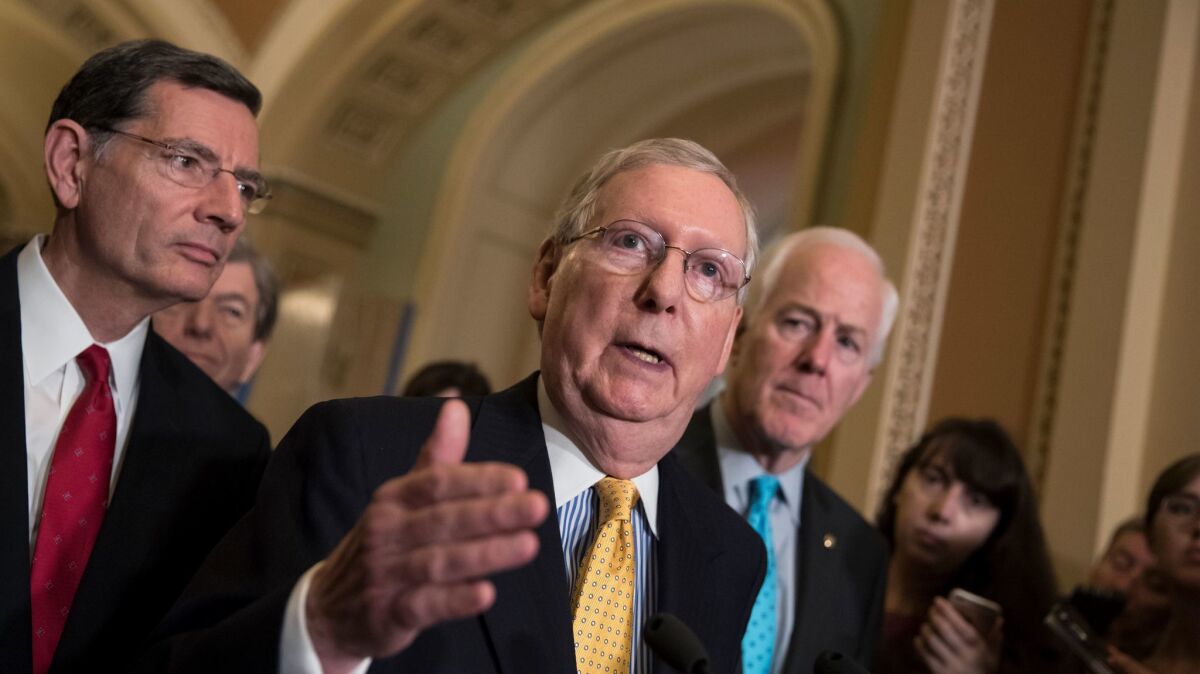 Still out to cut your healthcare: Senate Majority Leader Mitch McConnell, R-Ky., seen here flanked by Sen. John Barrasso, R-Wyo., left, and Majority Whip John Cornyn, R-Texas, moved Wednesday to fast-track an Obamacare repeal bill.