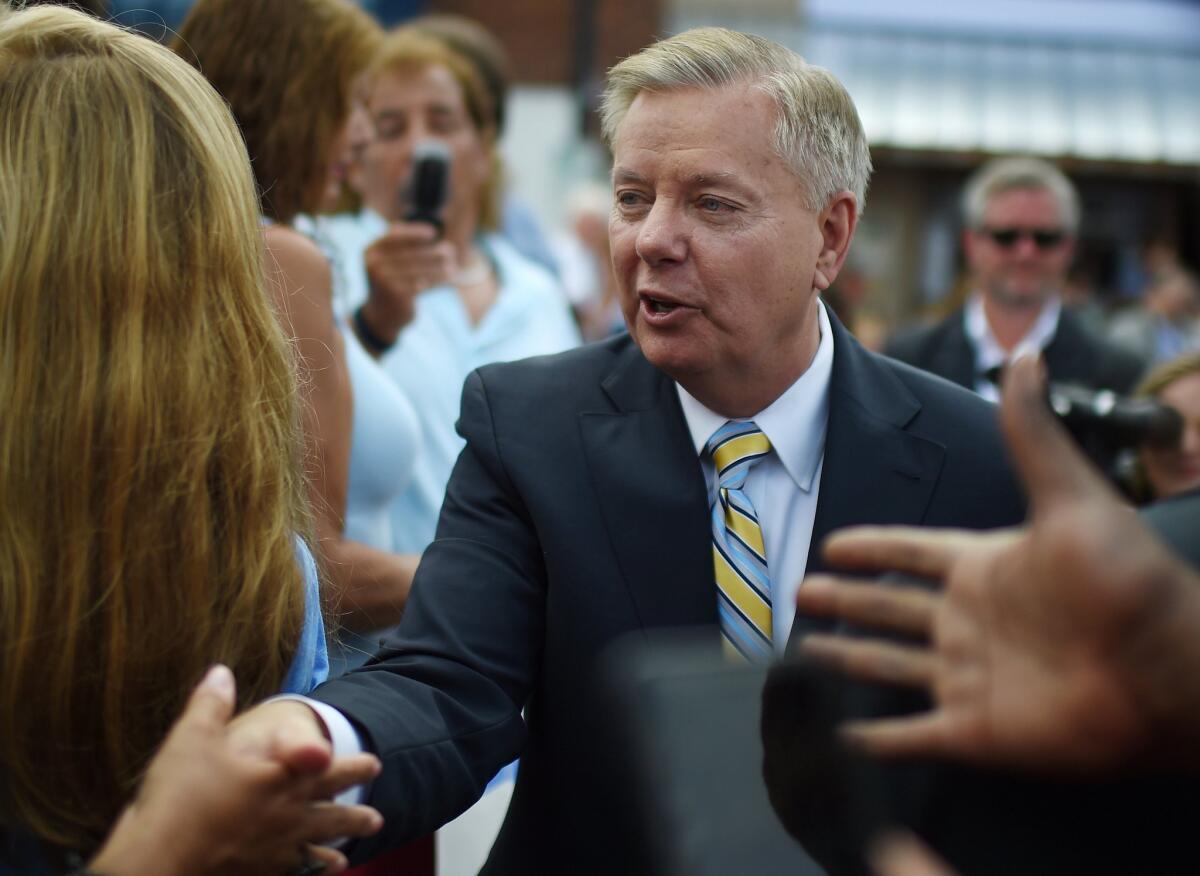 Republican presidential hopeful Sen. Lindsey Graham, seen here greeting supporters in his hometown of Central, S.C., has introduced a bill banning most late-term abortions.