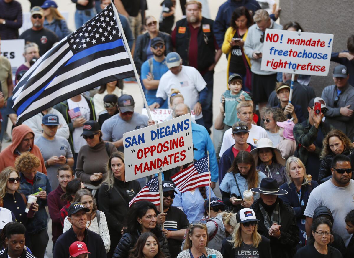 Police, firefighters and their families attended a news conference by ReOpen San Diego to oppose vaccination mandates.