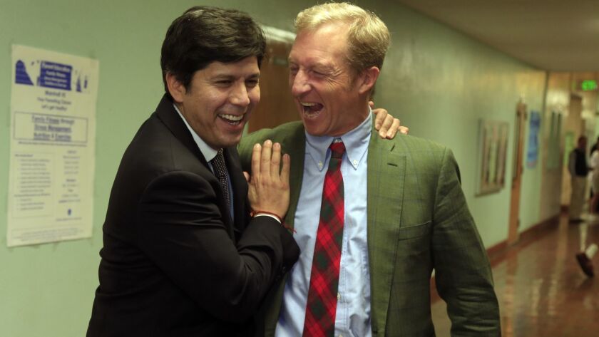 California state Sen. Kevin de León (D-Los Angeles), left, and billionaire activist Tom Steyer, shown at John Marshall High School in L.A. in 2014, have a long friendship.
