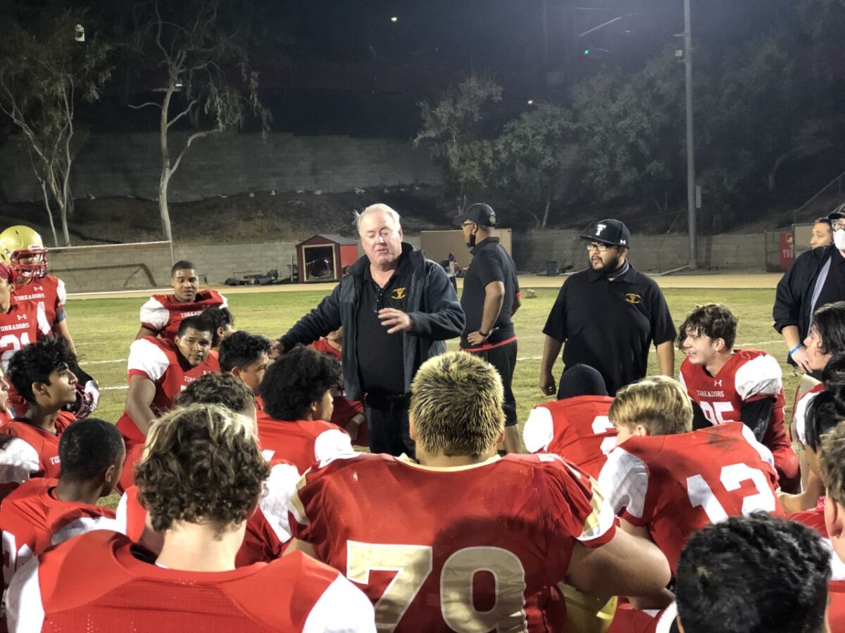 Taft football coach Jeff Kearin with his team