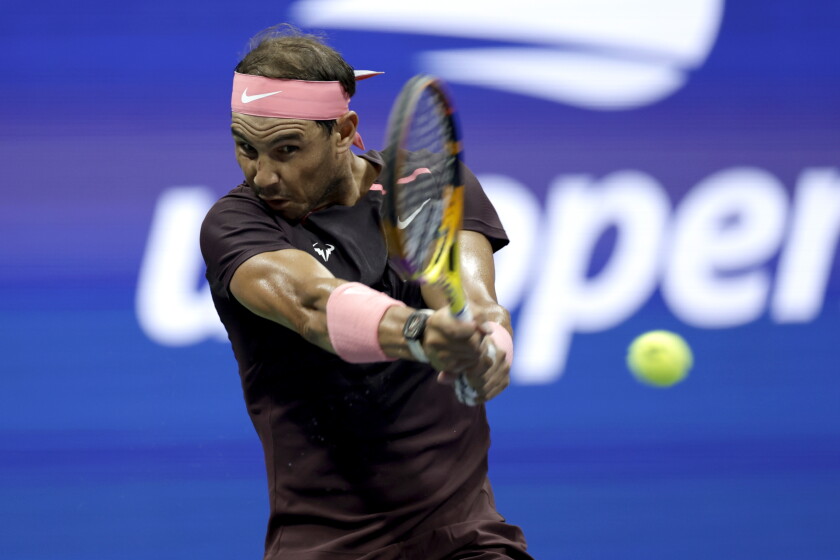Rafael Nadal returns a shot to Richard Gasquet during their third-round match in the U.S. Open.
