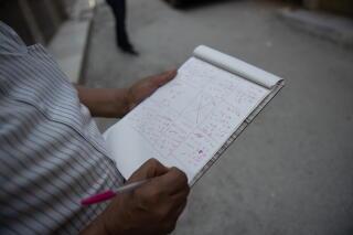an engineer working to survey the damaged buildings