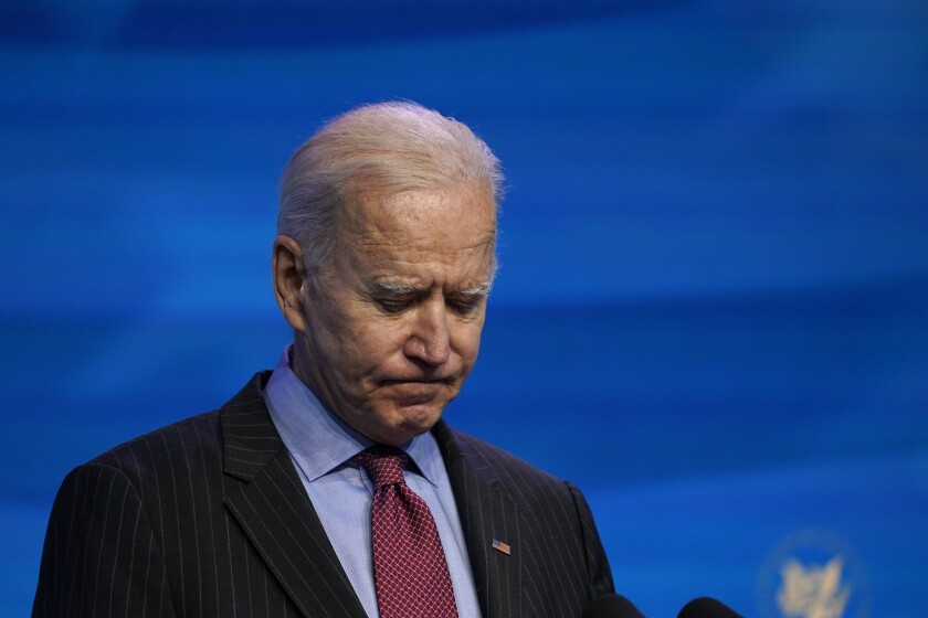 FILE - In this Jan. 8, 2021, file photo President-elect Joe Biden speaks during an event at The Queen theater in Wilmington, Del. When Biden takes office later this month, his biggest challenge may be navigating a deeply divided country past the turmoil of the Trump era. (AP Photo/Susan Walsh, File)