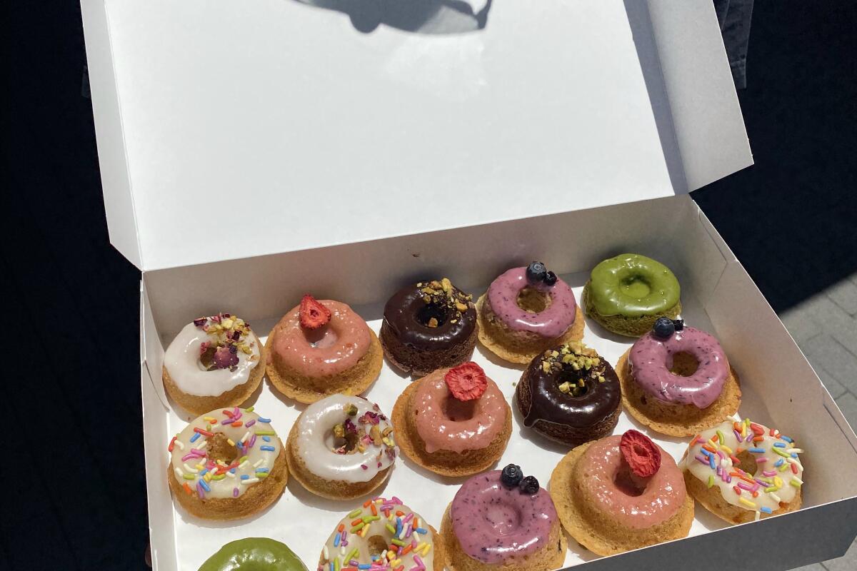 A box of colorful donuts from Verto's Kitchen.