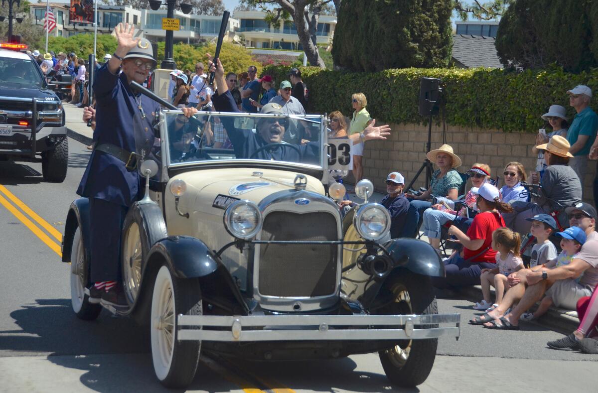 Keystone Kops from left, Steve Bromberg, Lloyd Ikerd and Earl McDaniel, driving a Ford Model A, are crowd favorites.