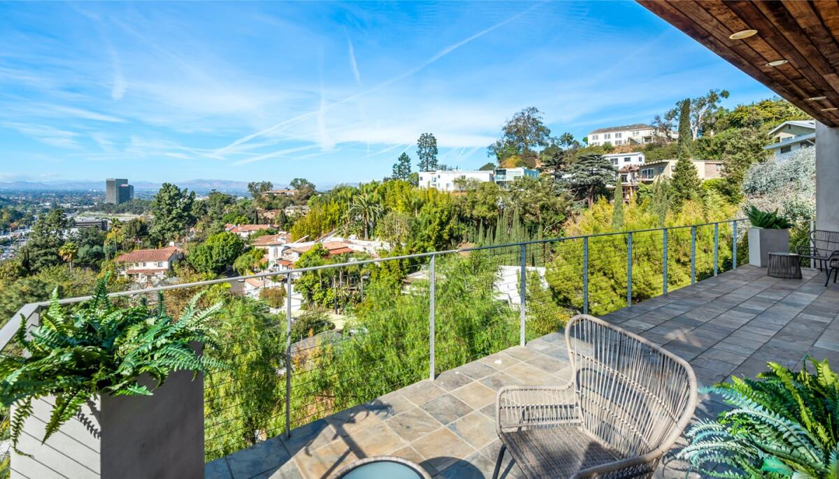 Spanning three stories, the 1960s home has light-filled living spaces with clerestories, skylights and walls of glass.