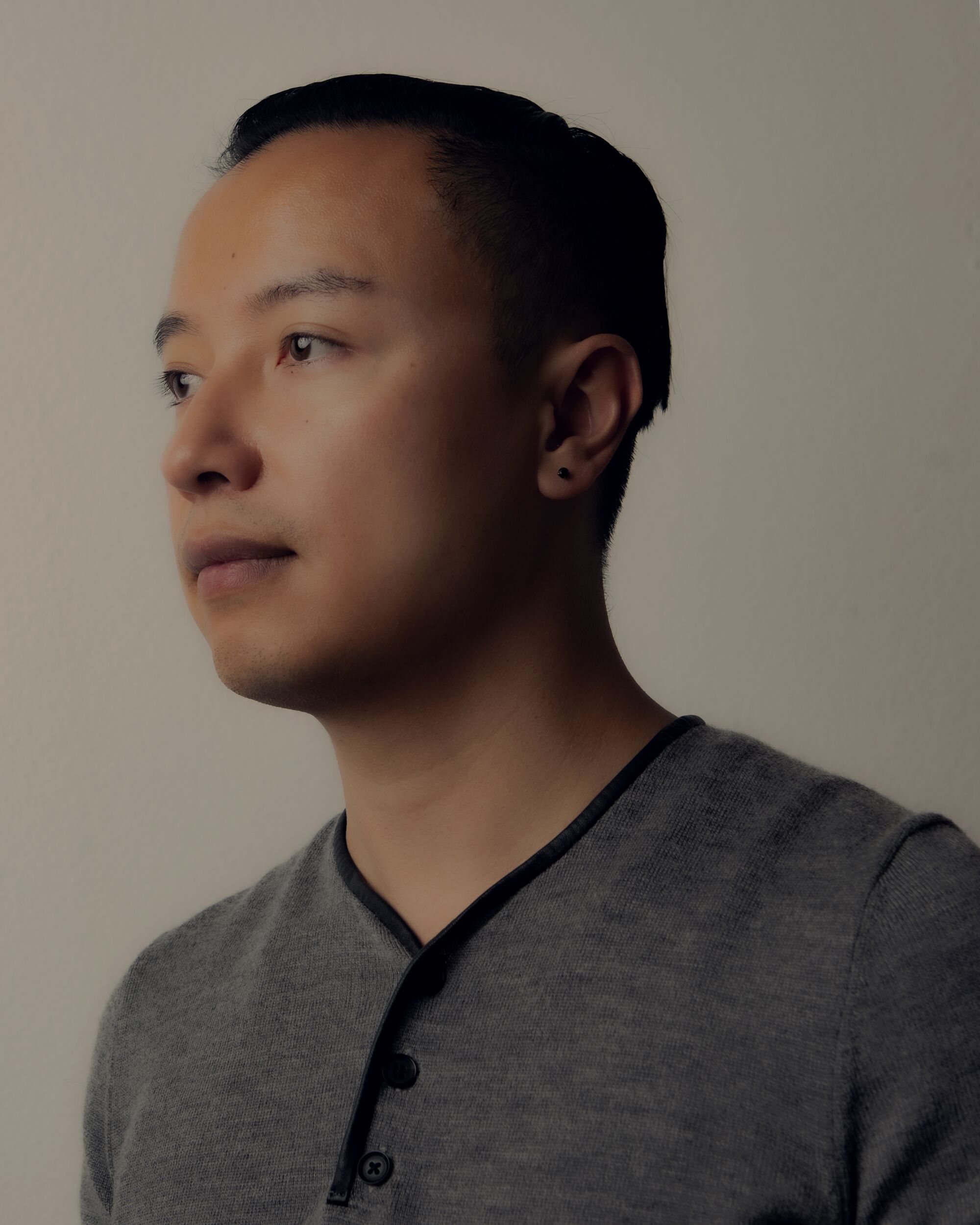 Brendan Nguyen poses for a portrait at his home studio in downtown San Diego.