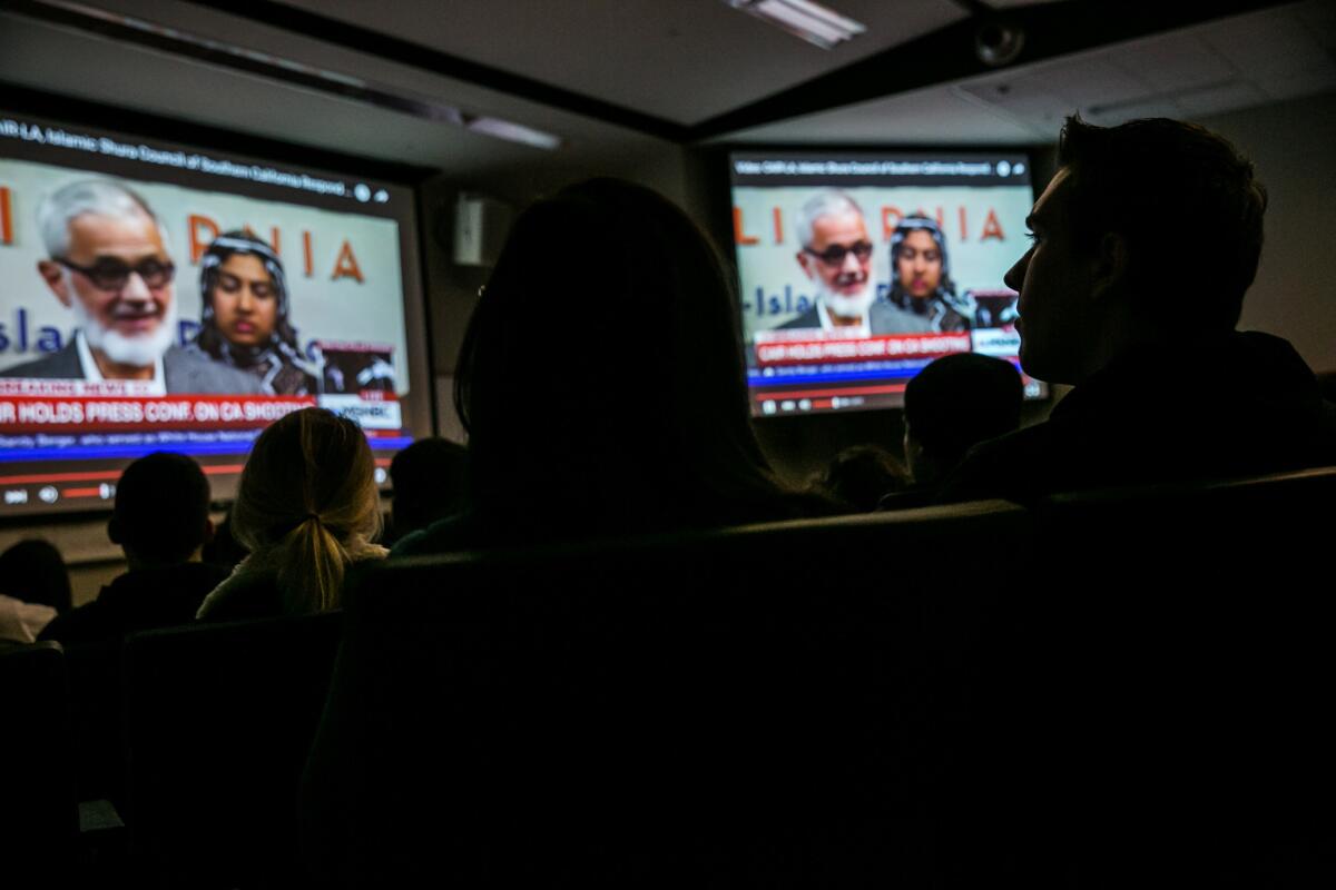 Students watch a news program in Dany Doueiri's World of Islam class.