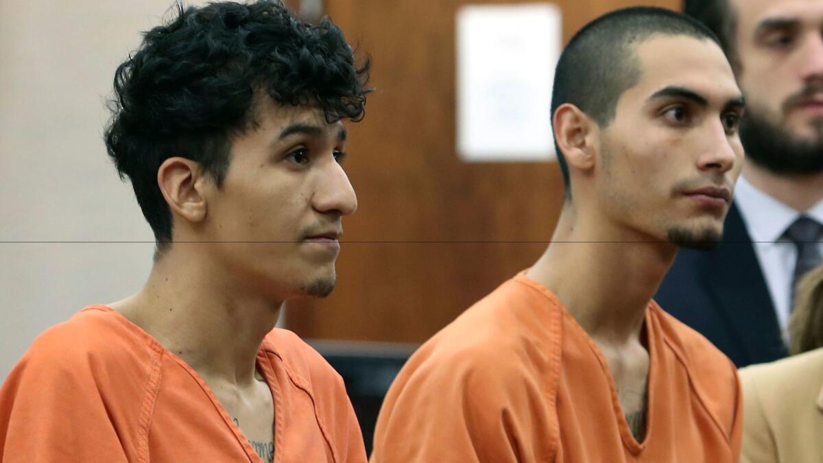 Two MS-13 gang members from El Salvador, Miguel Alvarez-Flores, left, and Diego Hernandez-Rivera, appear in court in Houston on Thursday in a kidnapping and murder case.