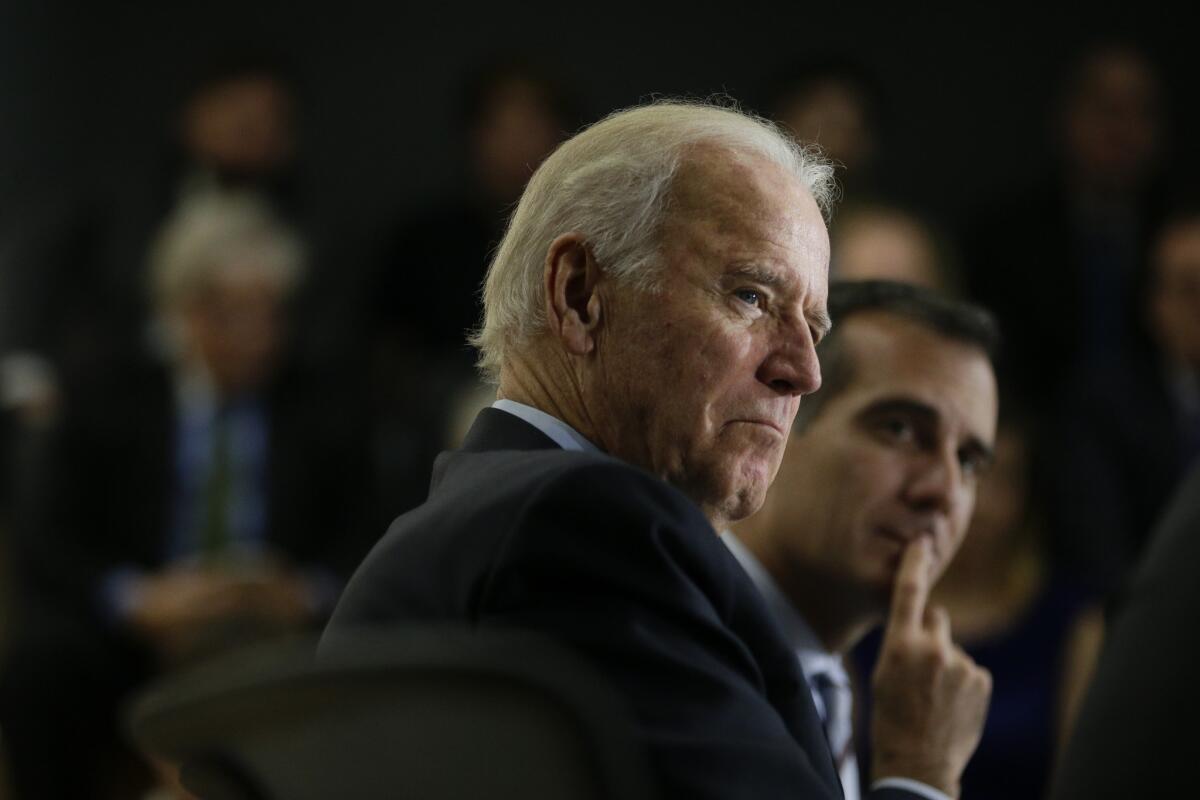 Then-Vice President Joe Biden sits alongside Mayor Eric Garcetti in 2015. 