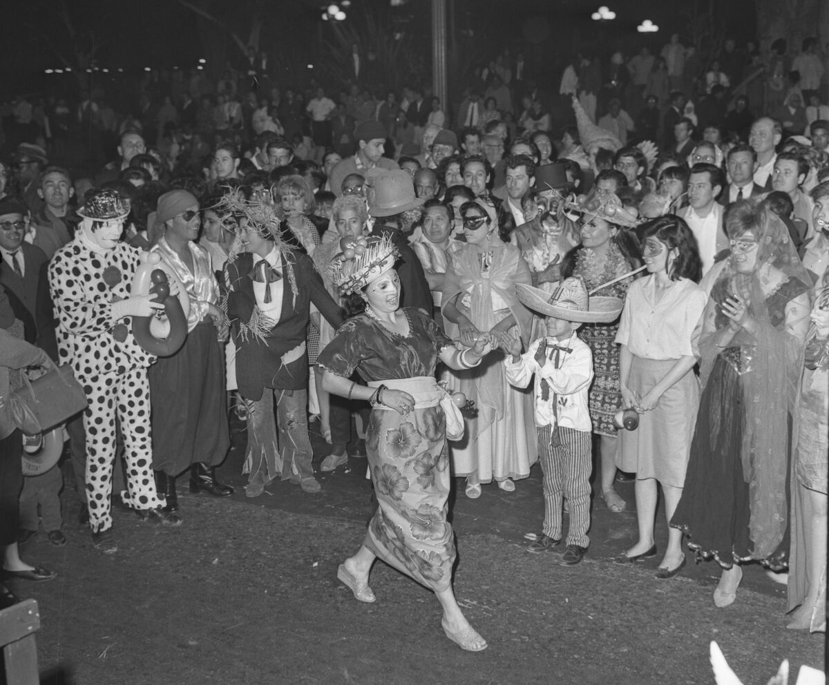 People in costumes during Mardi Gras celebration.