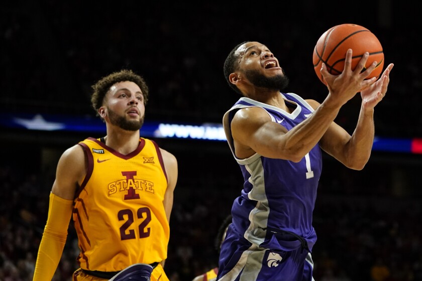 Kansas State guard Markquis Nowell (1) drives to the basket ahead of Iowa State guard Gabe Kalscheur (22) during the second half of an NCAA college basketball game, Saturday, Feb. 12, 2022, in Ames, Iowa. (AP Photo/Charlie Neibergall)
