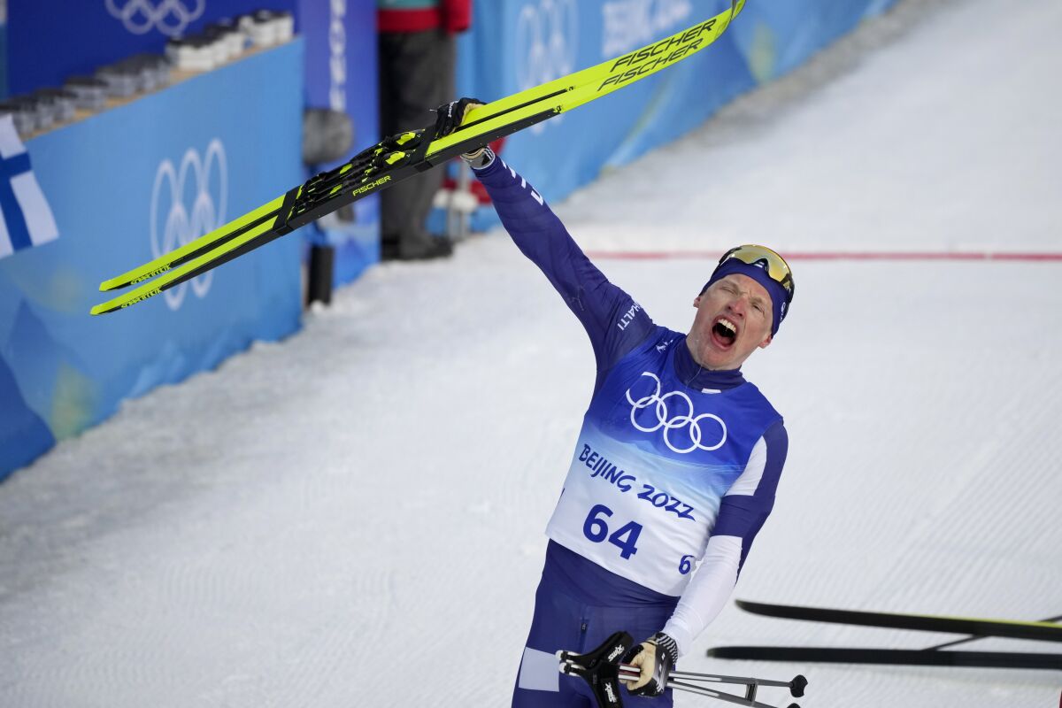 Iivo Niskanen, of Finland, celebrates after finishing the men's 15km classic cross-country skiing competition at the 2022 Winter Olympics, Friday, Feb. 11, 2022, in Zhangjiakou, China. (AP Photo/Aaron Favila)