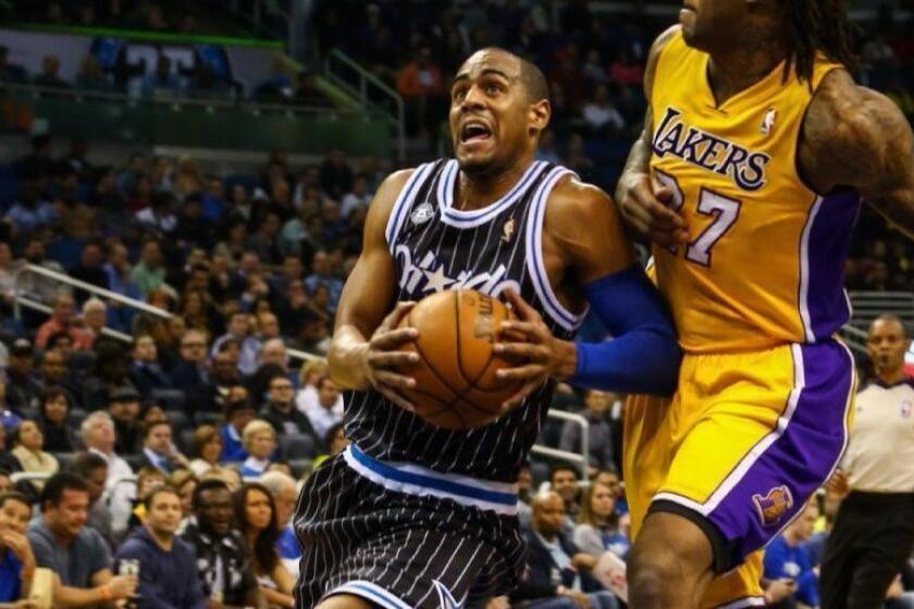 Orlando Magic forward Arron Afflalo (4) drives around the Lakers' Jordan Hill (27) during first quarter action of an NBA game against the Los Angeles Lakers at Amway Center in Orlando, Fla. on Friday, January 24, 2014. (Joshua C. Cruey/Orlando Sentinel)