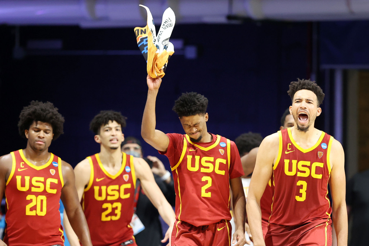 USC's Isaiah Mobley, Tahj Eaddy Max Agbonkpolo and Ethan Anderson celebrate.