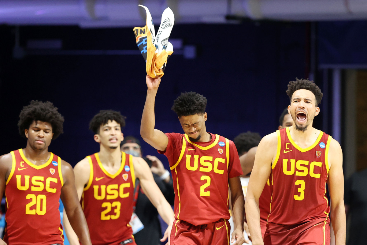 Ethan Anderson, Max Agbonkpolo, Isaiah Mobley and Tahj Eaddy in USC jerseys.