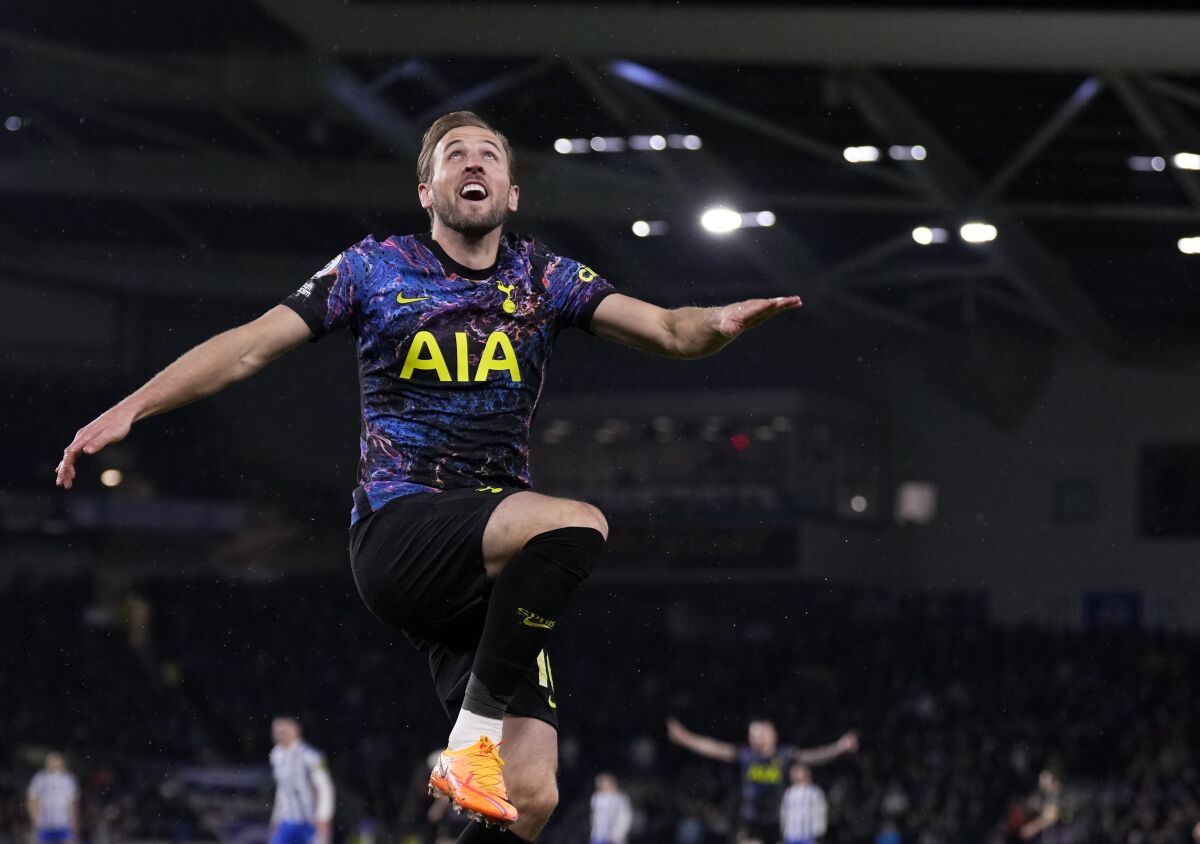 Tottenham's Harry Kane celebrates after scoring his side's second goal during the English Premier League soccer match between Brighton and Tottenham Hotspur at the Falmer stadium in Brighton, England, Wednesday, March 16, 2022. (AP Photo/Matt Dunham)