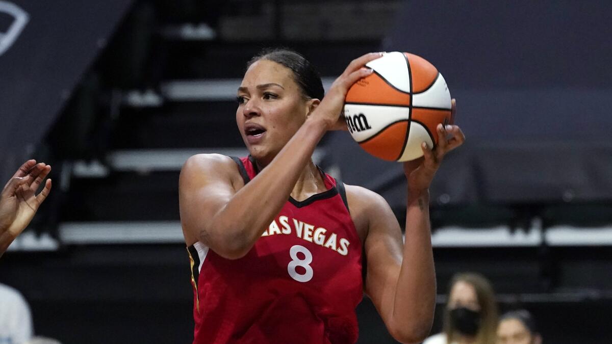 Las Vegas Aces' Liz Cambage holds the ball during a game.