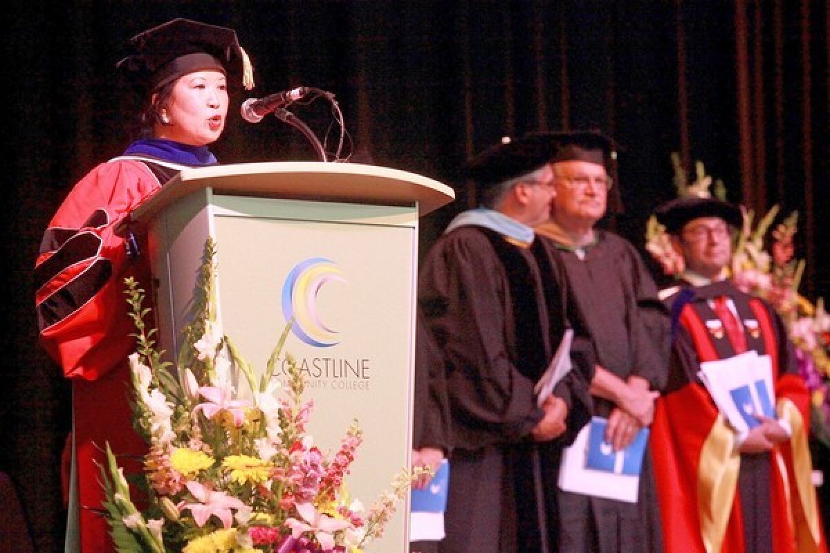 President Loretta Adrian, left, speaks during graduation in 2013.