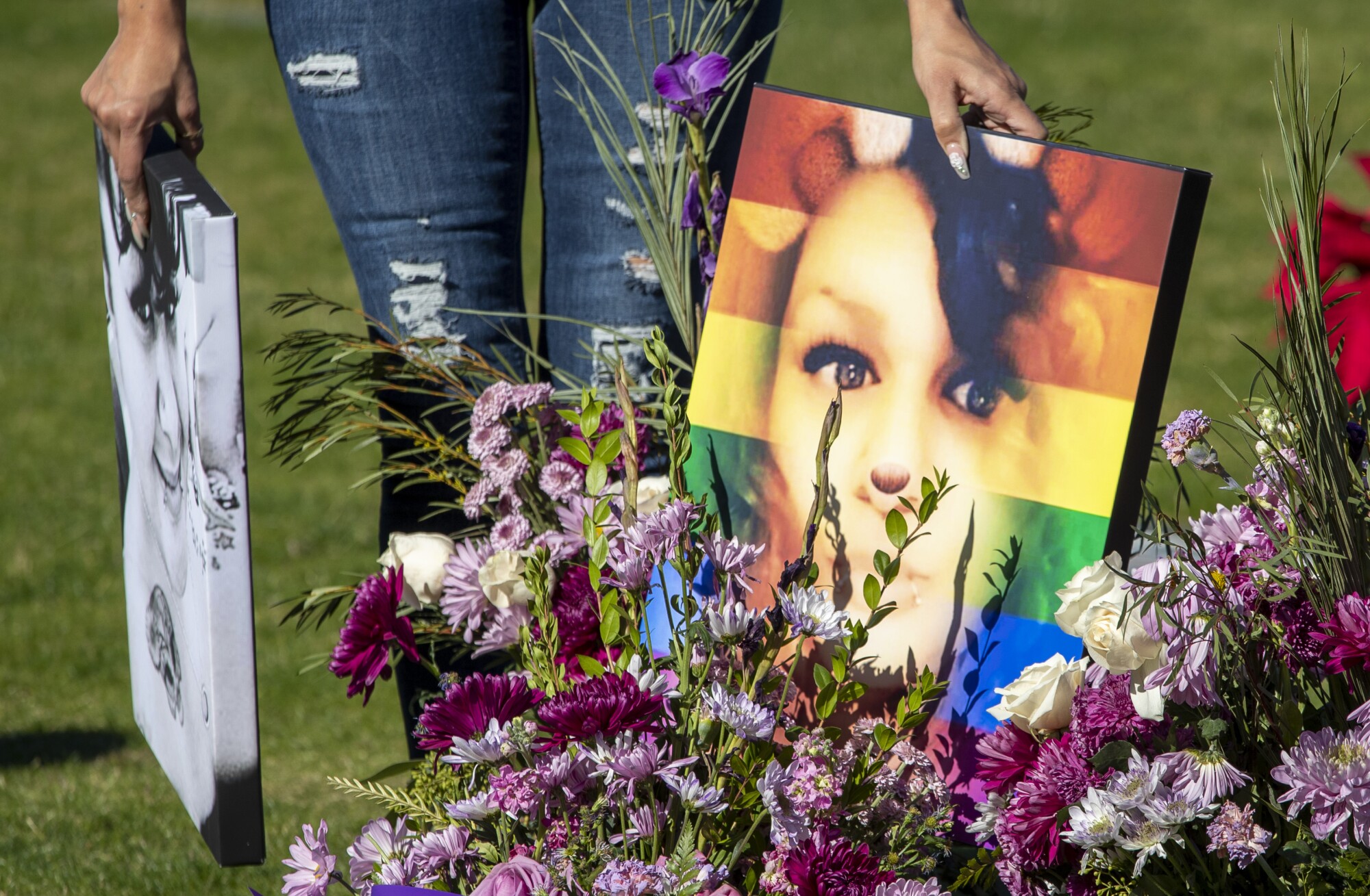 Getty Alvarado gathers photos of Tatyana Cantu Broughton following a memorial service at Desert Memorial Park.