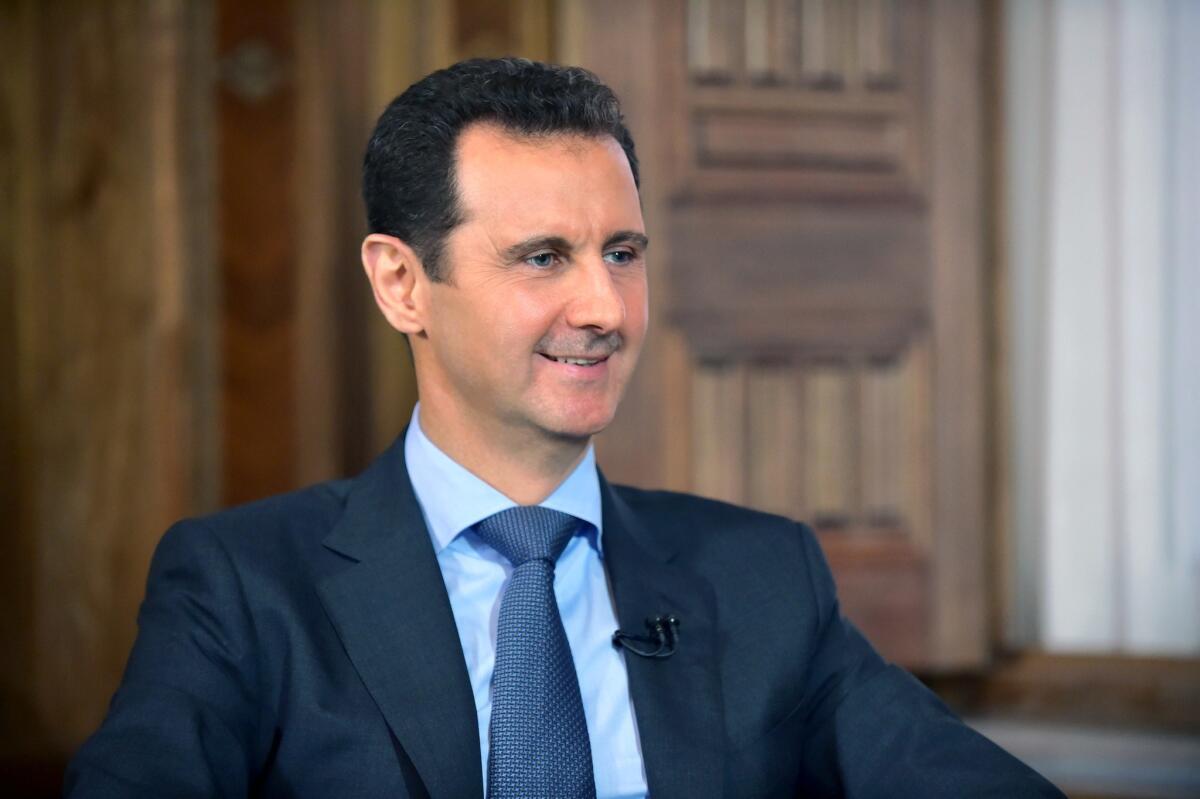 Syrian President Bashar Assad is seen answering questions during an August interview in Damascus in a picture released by the official Syrian Arab News Agency.