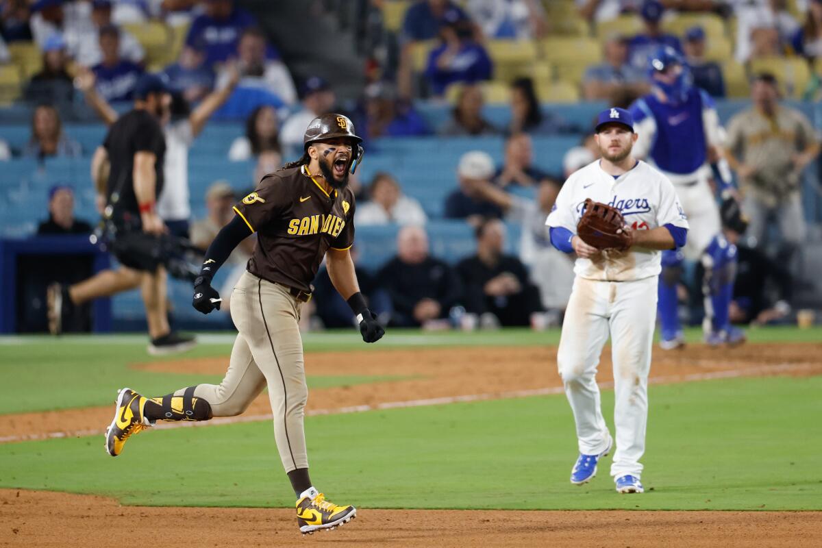 San Diego's Fernando Tatis Jr. celebrates after hitting a two-run home run in the ninth inning Sunday.